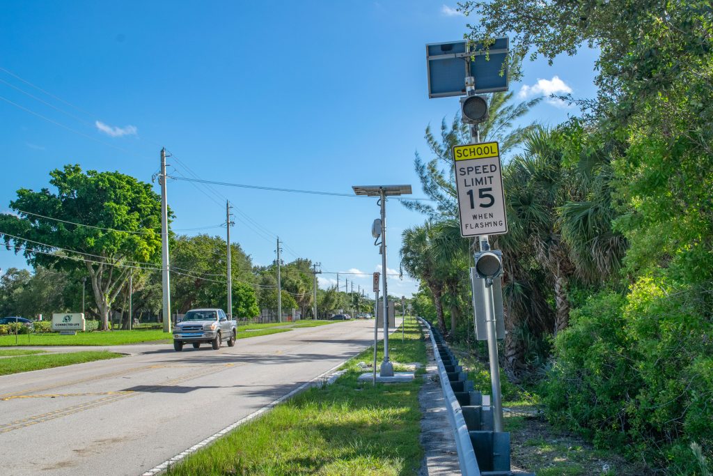 School speed cameras and zone signs near the J.C. Mitchell Elementary School. (Photo: Boca Daily News)