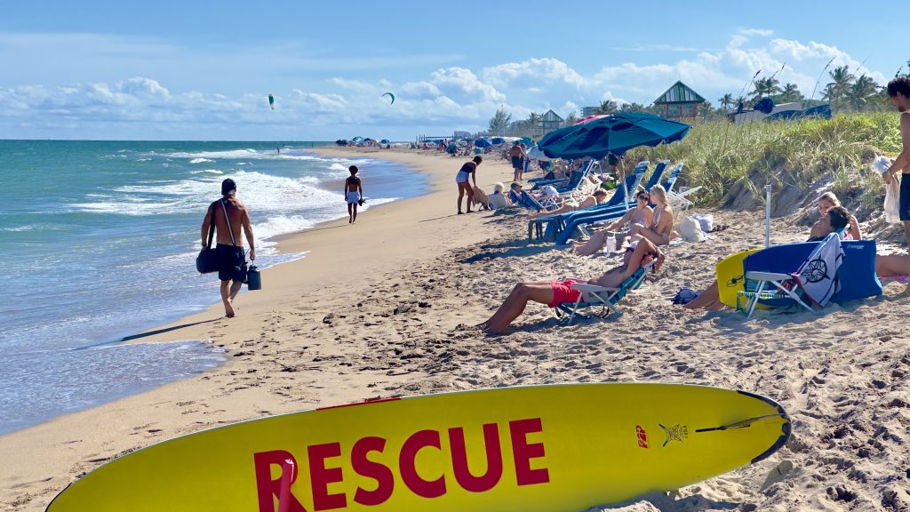 An eroded beach berm in Delray Beach, FL forces sunbathers into a small strip of sand in anticipation of a renourishment project, Oct. 2025. (Photo: Boca Daily News)