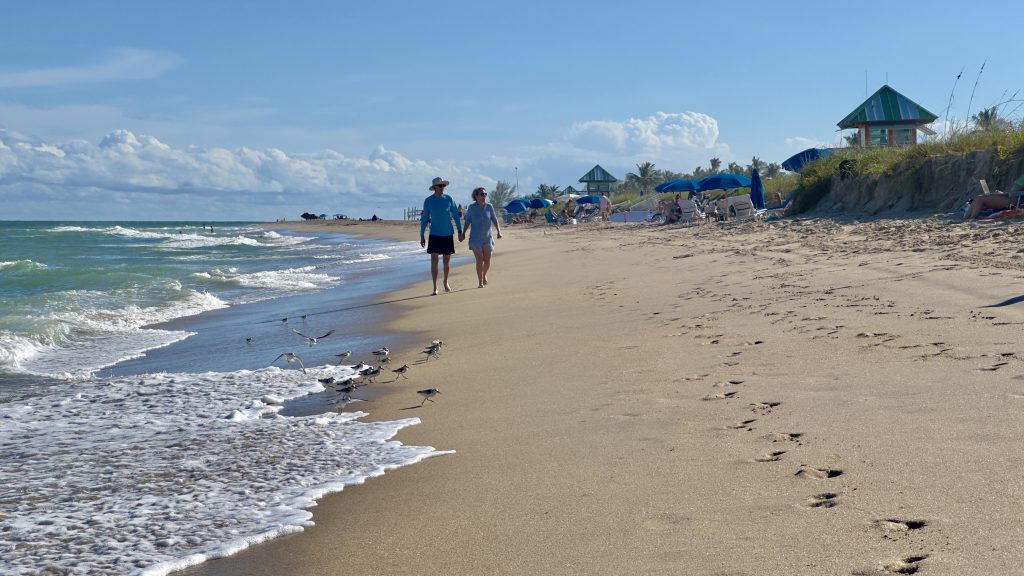 An eroded beach berm in Delray Beach, FL forces sunbathers into a small strip of sand in anticipation of a renourishment project, Oct. 2025. (Photo: Boca Daily News)