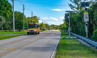 School speed cameras and zone signs near the J.C. Mitchell Elementary School. (Photo: Boca Daily News)