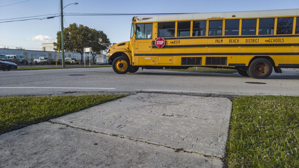 A school bus in the project area for sidewalk, roadway and water main improvements in the Delray Manors neighborhood, Boca Raton, FL, Jan. 2026. (Photo: Boca Daily News)