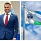 Andy Thomson (left) and the Boca Raton city flag.