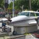 A Piper Twin Comanche PA-39 (PA-30 variant) at a boat ramp in Boca Raton, FL, being prepared to be removed by a crane after landing in the ocean, Aug. 23, 2026. (Photo: Boca Daily News)