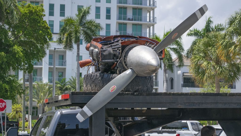 A Piper Twin Comanche PA-39 (PA-30 variant) at a boat ramp in Boca Raton, FL, being prepared to be removed by a crane after landing in the ocean, Aug. 23, 2026. (Photo: Boca Daily News)