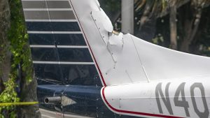 A Piper Twin Comanche PA-39 (PA-30 variant) at a boat ramp in Boca Raton, FL, being prepared to be removed by a crane after landing in the ocean, Aug. 23, 2026. (Photo: Boca Daily News)