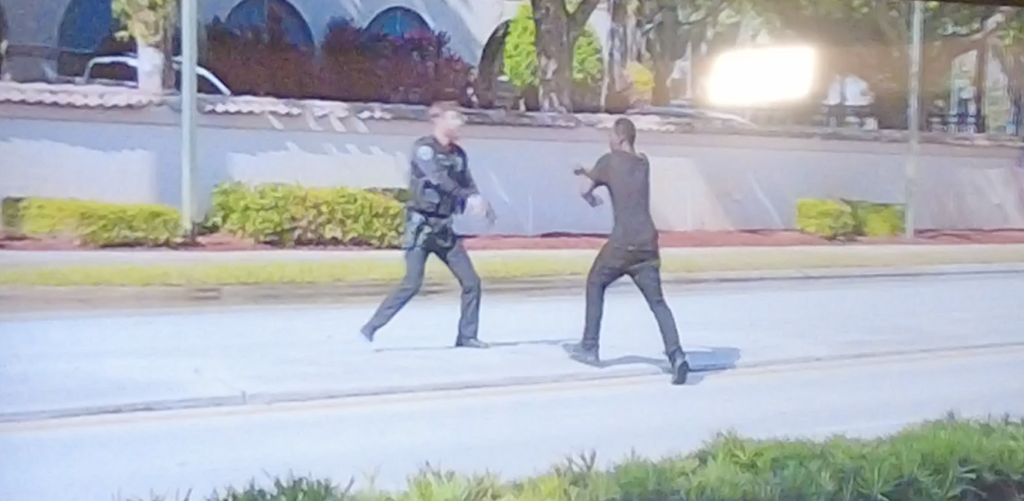 Surveillance footage capturing a fatal police shooting in Boca Raton, FL, Dec. 2024, as released in Oct. 2026. (Boca Daily News)